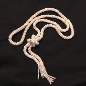 Faux pearl necklace.